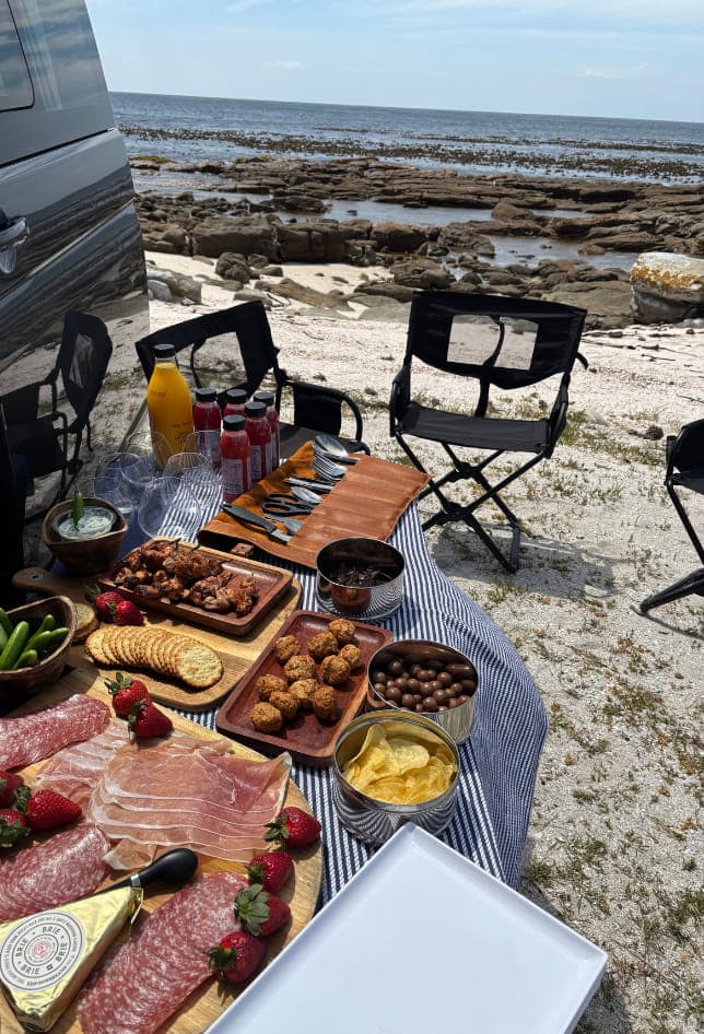 Luxury picnic setup at Cape Point Nature Reserve with ocean views and scenic coastline
